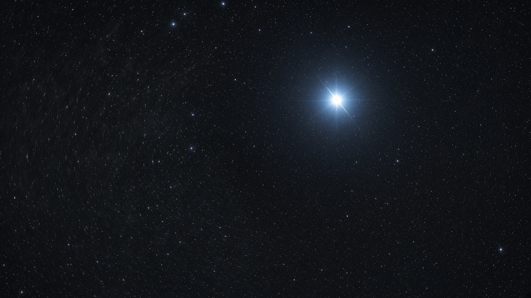 A bright blue-white star, clearly offset from the emptier point of the pole.
